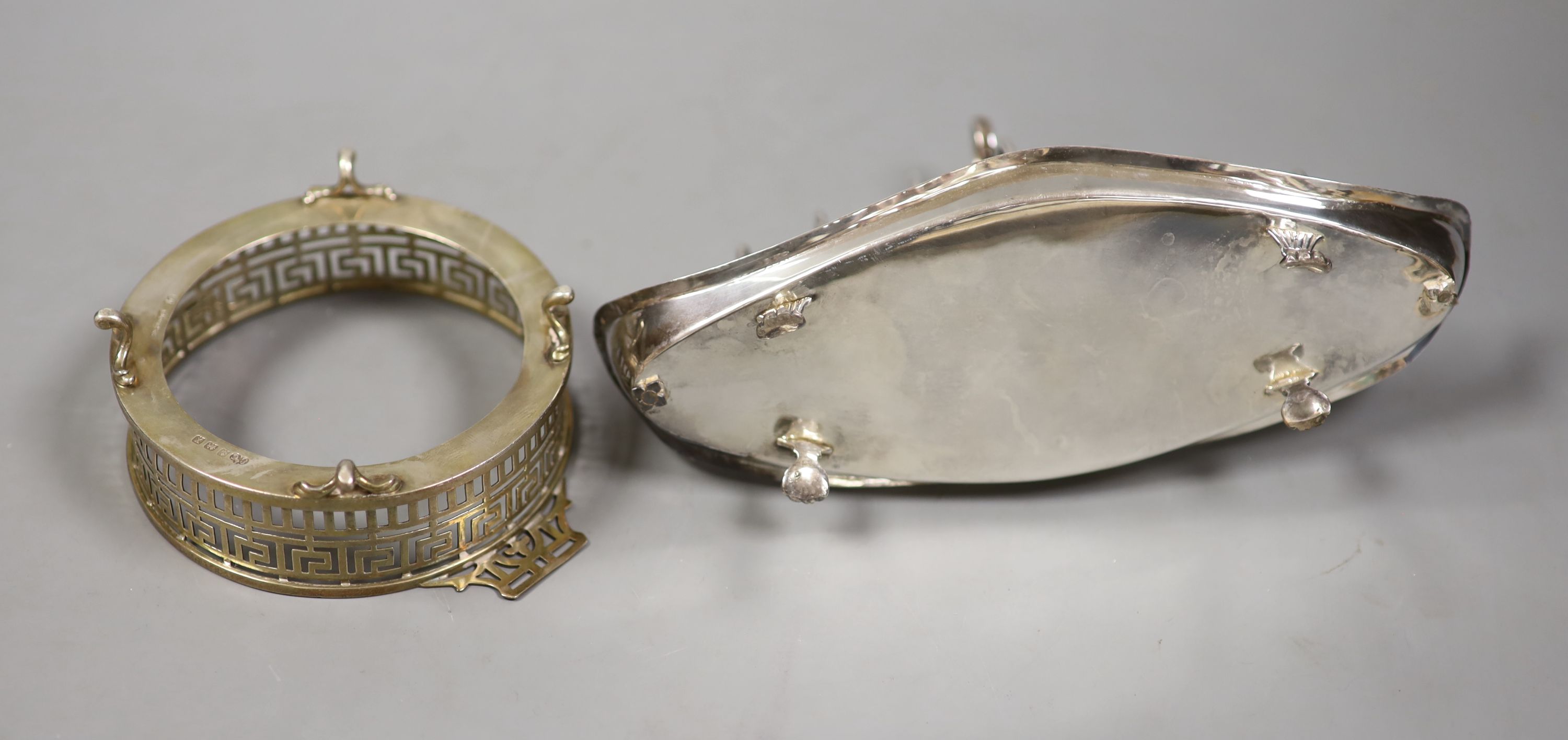 A late Victorian silver seven bar toastrack, with shaped ring handle, on paw feet, Josiah Williams & Co, London, 1896?, 21.2cm and a silver dish, lacking glass liner